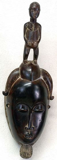 Ekoi headdress on wooden stand, Nigeria